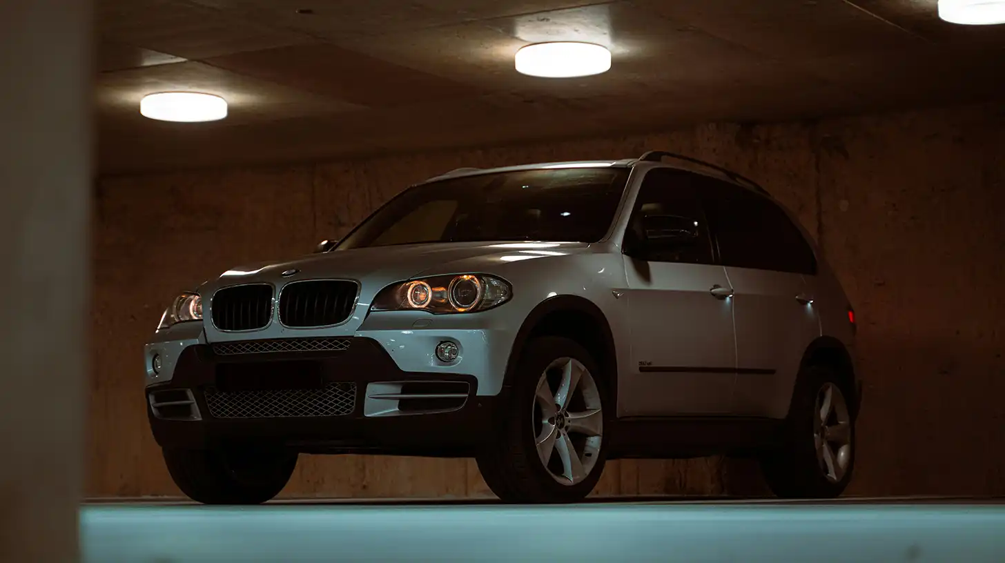 Silver BMW SUV in garage